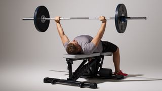 Model demonstrating perfect bench press form