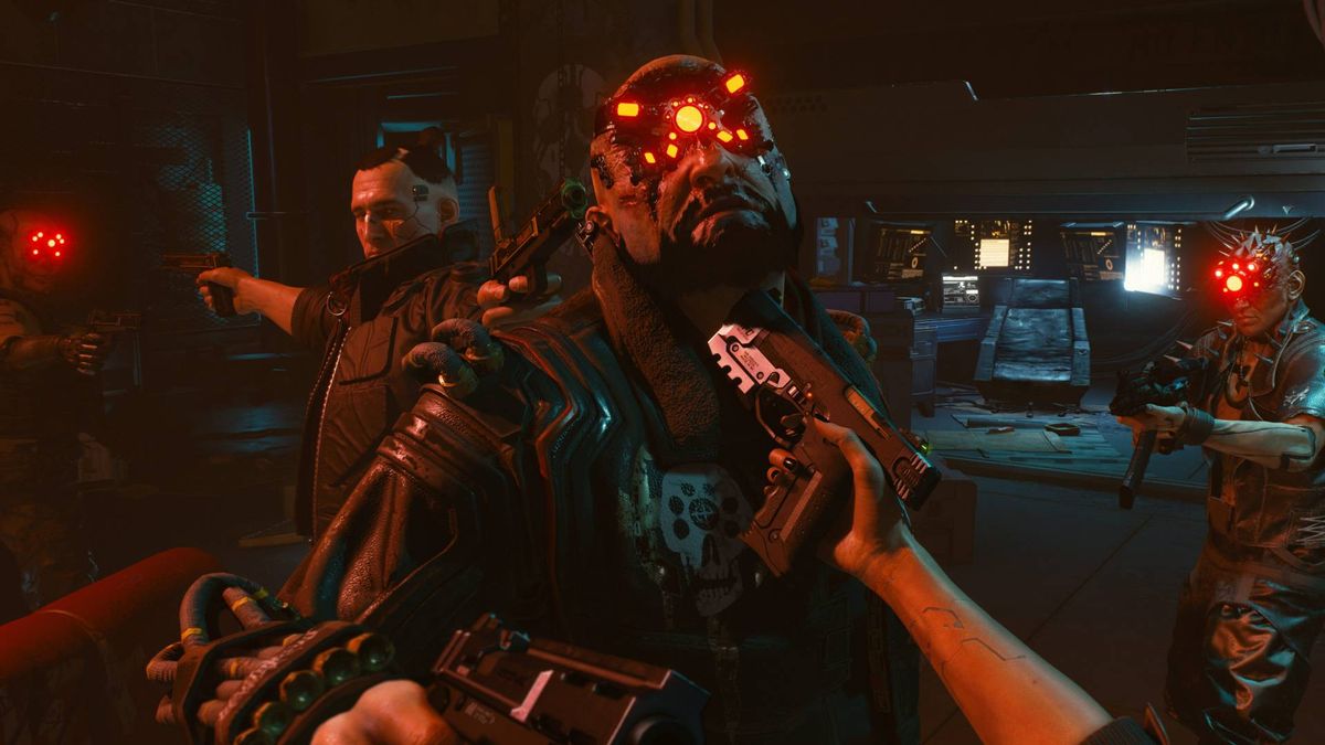 V holding a gun to Royce&#039;s neck in Cyberpunk 2077 with Jackie aiming a pistol at him, and two henchmen in the background also pointing their weapons.