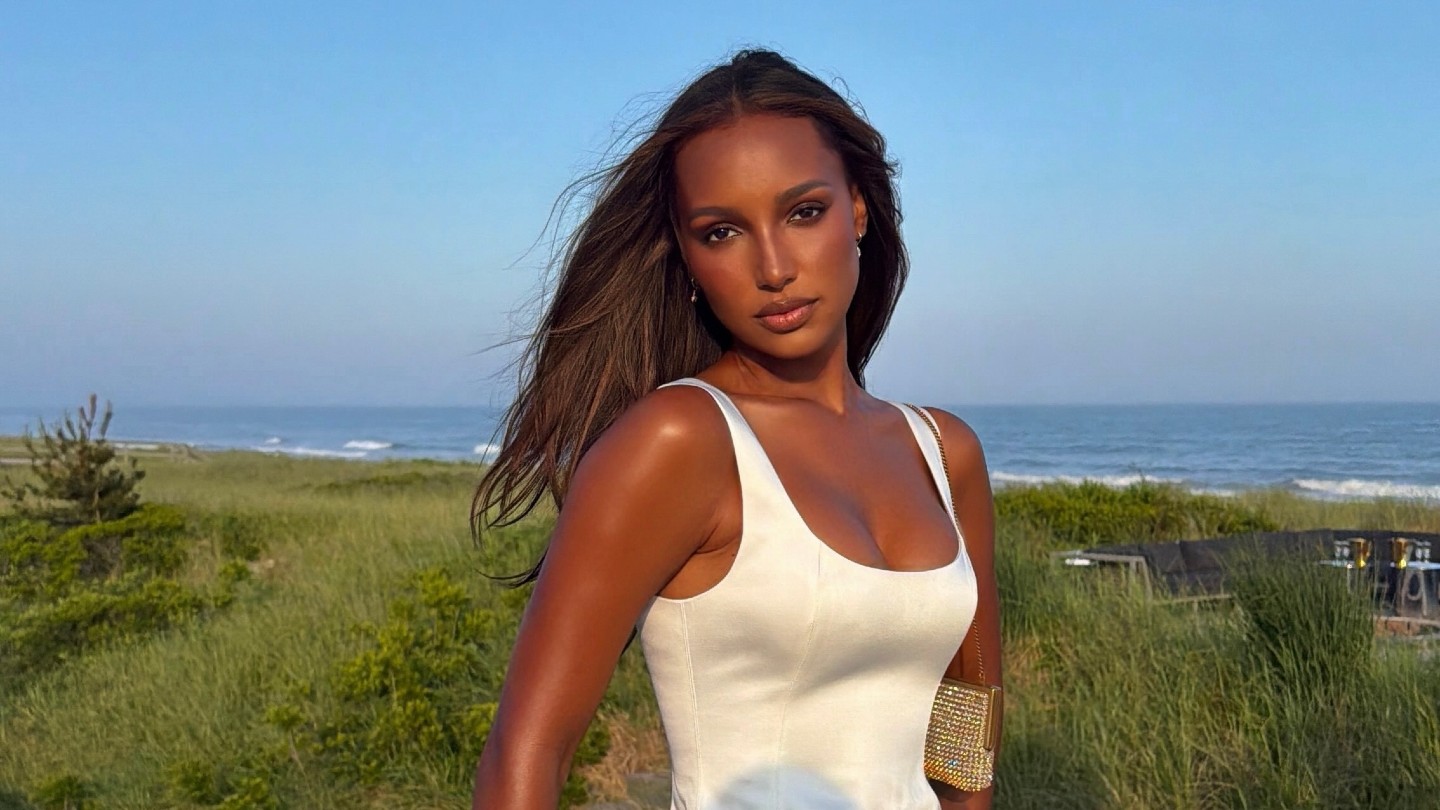 Photo of Jasmine Tookes wearing a white dress in the Hamptons