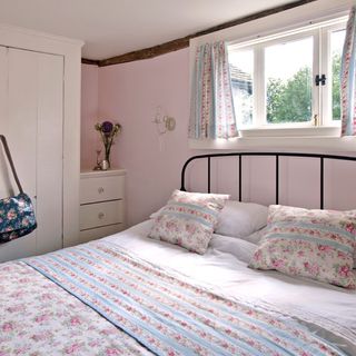 guest room with pink coloured and bed