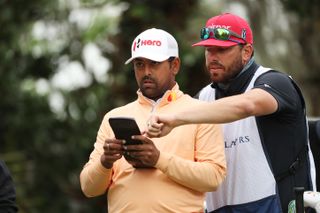 Anirban Lahiri and Tim Giuliano in conversation during the 2022 Players Championship - in which the Indian golfer finished second