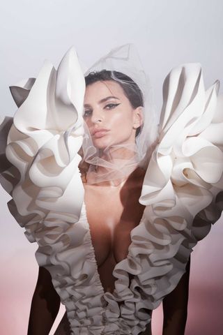 Emily Ratajkowski wearing an angel wing dress for the Viktor & Rolf Flowerbomb Tigerlily campaign