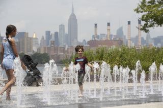 Kids cool off at a splash pad in New York City