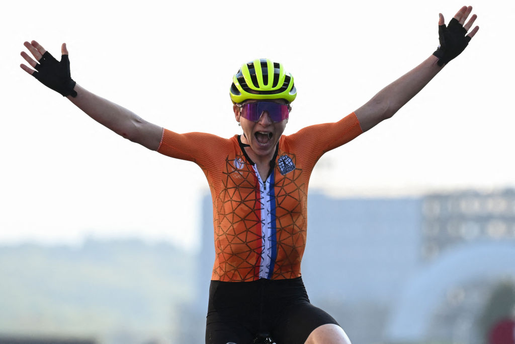 Netherlands Annemiek Van Vleuten celebrates as she crosses the finish line in second place in the womens cycling road race of the Tokyo 2020 Olympic Games at the Fuji International Speedway in Oyama Japan on July 25 2021 Photo by Greg Baker AFP Photo by GREG BAKERAFP via Getty Images