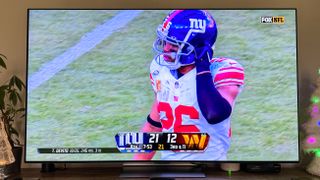 LG G3 OLED TV showing NFL football game