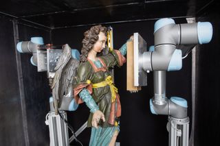 InsightART's scanner based on space-flown technology analyzes a statue of an angel.