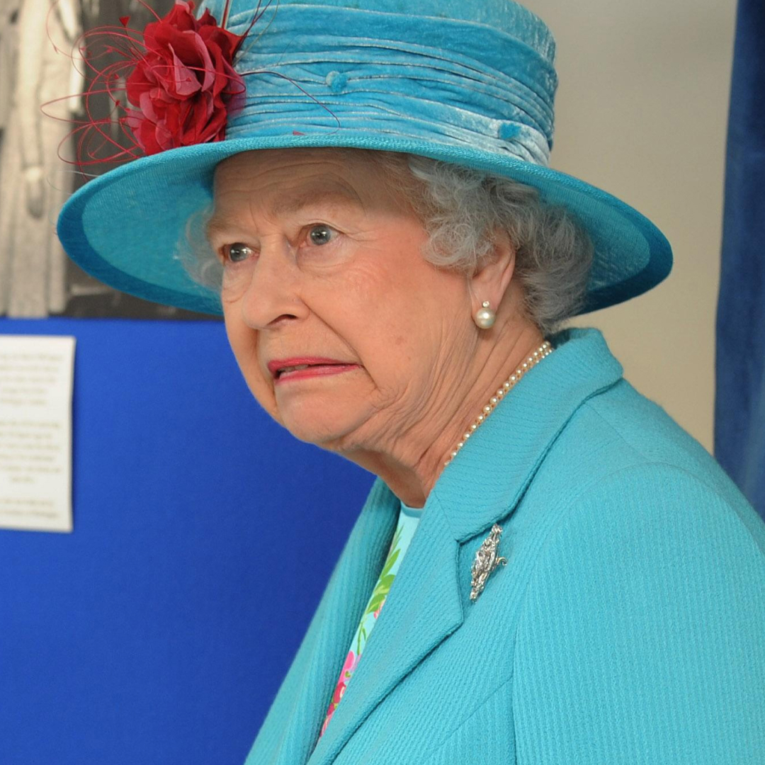 Queen Elizabeth wears a turquoise suit and matching hat while visiting Cumberland Pencil Company on June 5, 2008 in Cumbria, England