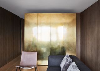 a studio apartment with a brass bedroom