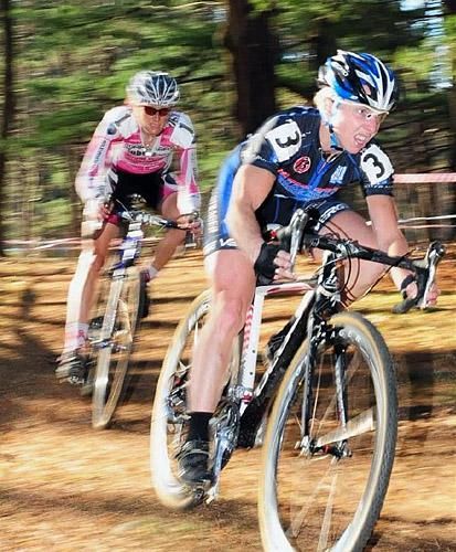 Laura Van Gilder (C3 Athletes Serving Athletes) streaking through the woods with Elliot.