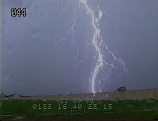 A pair of lightning strikes occurred near the space shuttle Atlantis on Launch Pad 39A at NASA's Kennedy Space Center on July 7. The first struck the water tower 515 feet from the pad and the second struck the beach area northeast of the pad. Early data indicate no issues with the shuttle or its systems. Credit: NASA