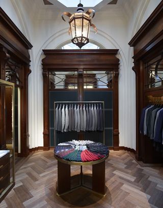 Custom merchandising units were designed to represent cabinetry found in a traditional haberdashery