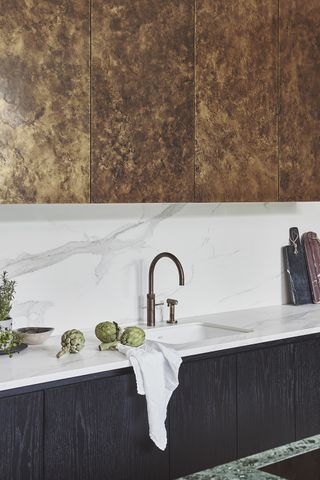 white kitchen backsplash ideas with patinated tap