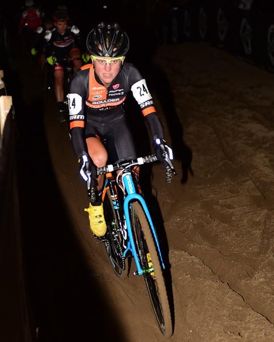 Amanda Miller (Boulder Cycle Sport) leading a long train of riders in the sand