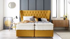 bedroom with grey panelling and yellow bed by harrison spinks