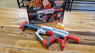 Nerf Pro Gelfire Mythic and box on a wooden table