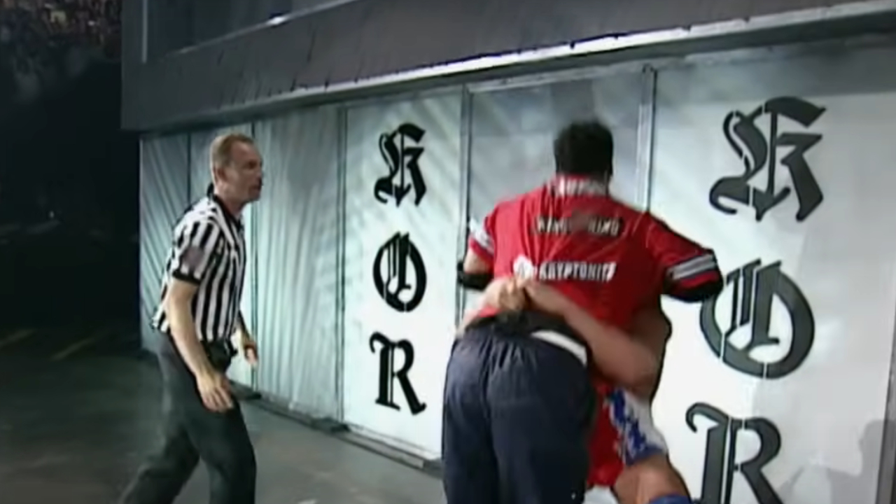 Kurt Angle suplexing Shane McMahon through a sheet of glass at King of the Ring 2001