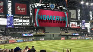 The new Daktronics scoreboard at Chase Field flashing a home run sign.