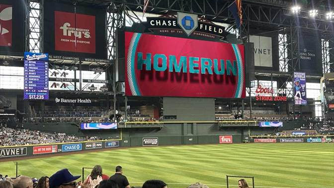 The new Daktronics scoreboard at Chase Field flashing a home run sign.