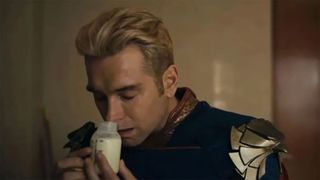 Homelander hungrily smelling a jar of breast milk