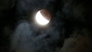 The Supermoon Eclipse is photographed from Bloomington, Indiana. The last time a Supermoon coincided with an eclipse was in 1982, and will not be repeated until 2033.