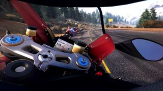 A first-person view from the perspective of a motorcycle racer.