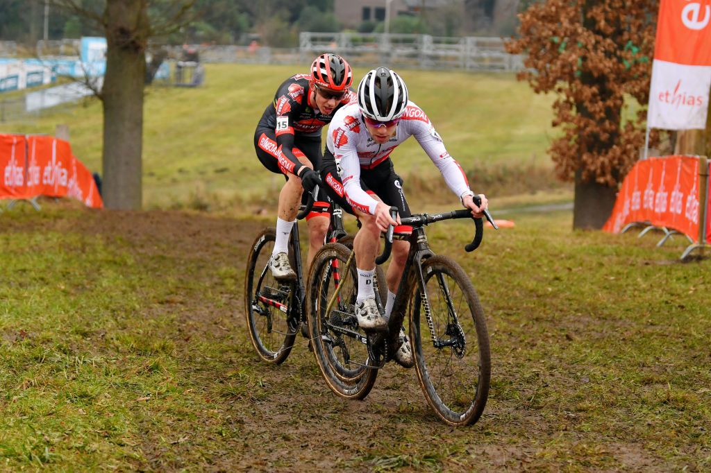 HOOGERHEIDE NETHERLANDS JANUARY 23 LR Michael Vanthourenhout of Belgium and Eli Iserbyt of Belgium and Team Pauwels Sauzen Bingoal compete during the 32nd GP Adrie Van der Poel Hoogerheide UCI CycloCross Worldcup 2022 Mens Elite CXWorldCup on January 23 2022 in Hoogerheide Netherlands Photo by Luc ClaessenGetty Images