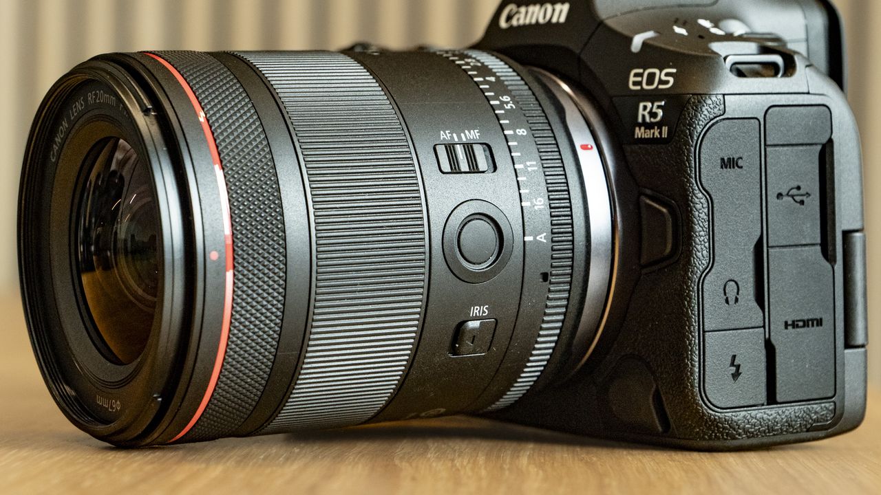 Close up of the Canon RF 20mm F1.4L VCM lens' controls, attached to the EOS R5 Mark II camera