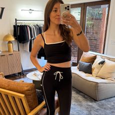 Woman in black and white activewear set