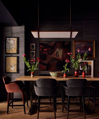 dark dining room with lots of artwork