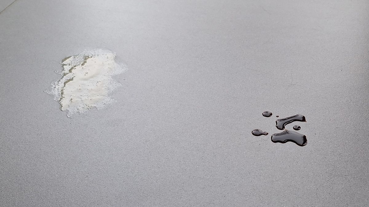 Honey and soy sauce on a tiled floor, ready for the mopping test with the Roborock Saros 20