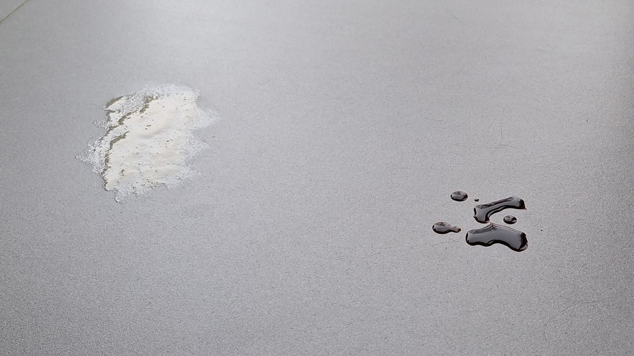 Honey and soy sauce on a tiled floor, ready for the mopping test with the Roborock Saros 20