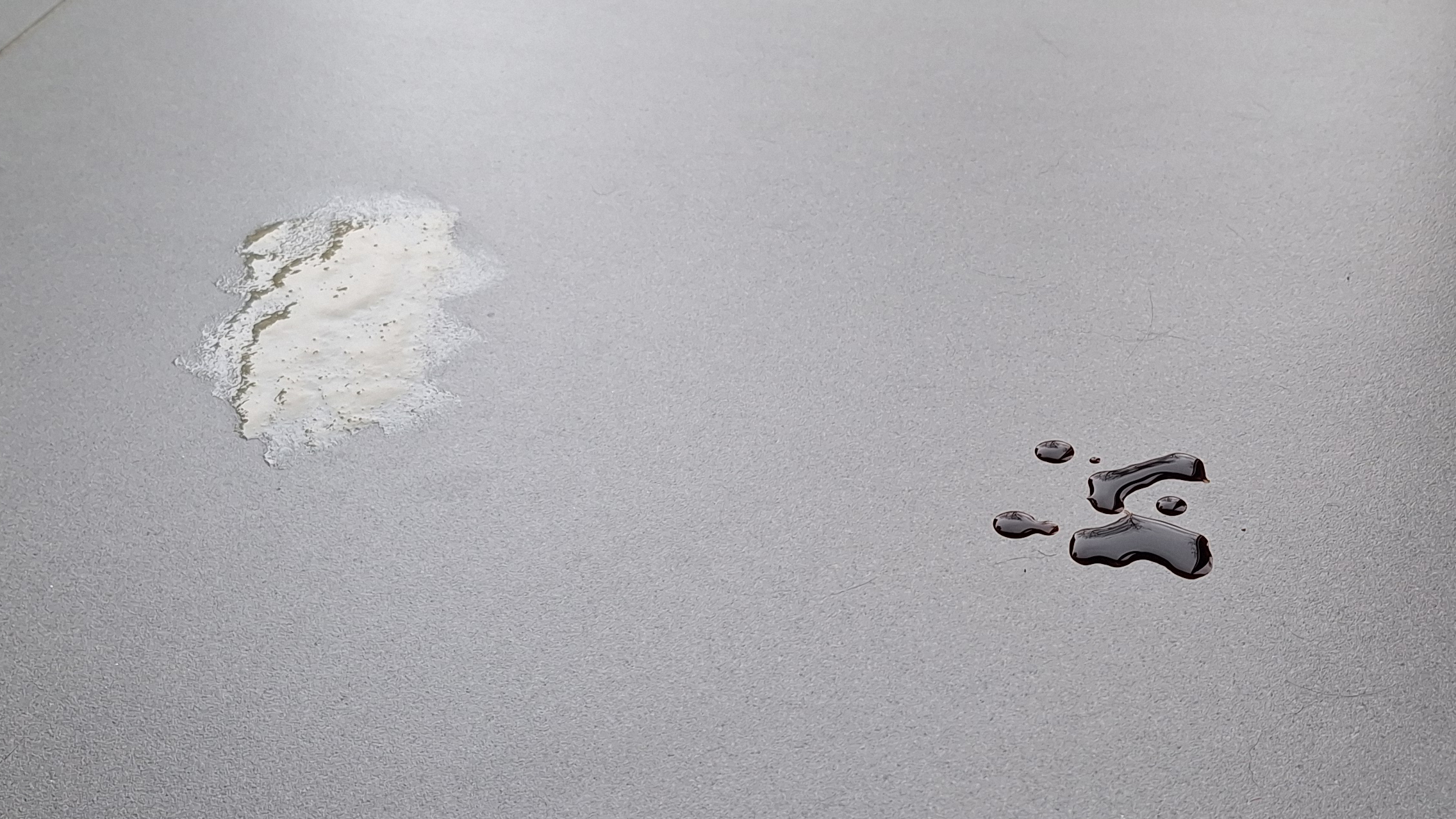 Honey and soy sauce on a tiled floor, ready for the mopping test with the Roborock Saros 20