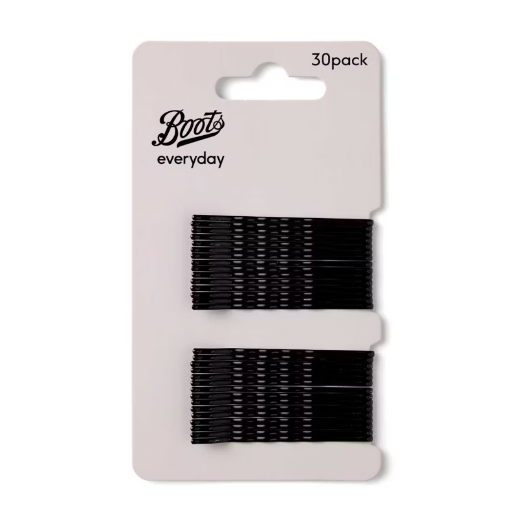 A product shot of a pack of Boots Black Hair Grips, on a white background