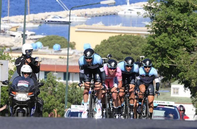 Mark Cavendish tucked on the OPQS train