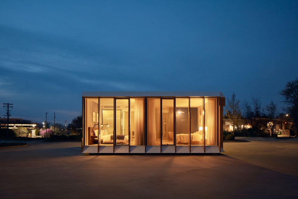 Mitek is a modular housing model by Danny Forster &amp; Architecture, seen here in a night shot