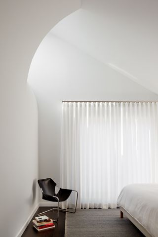 white bedroom with curves