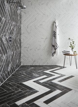 unique use of grey and white metro tiles to create a herringbone effect finish