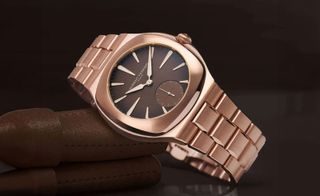 rose-gold watch with brown dial