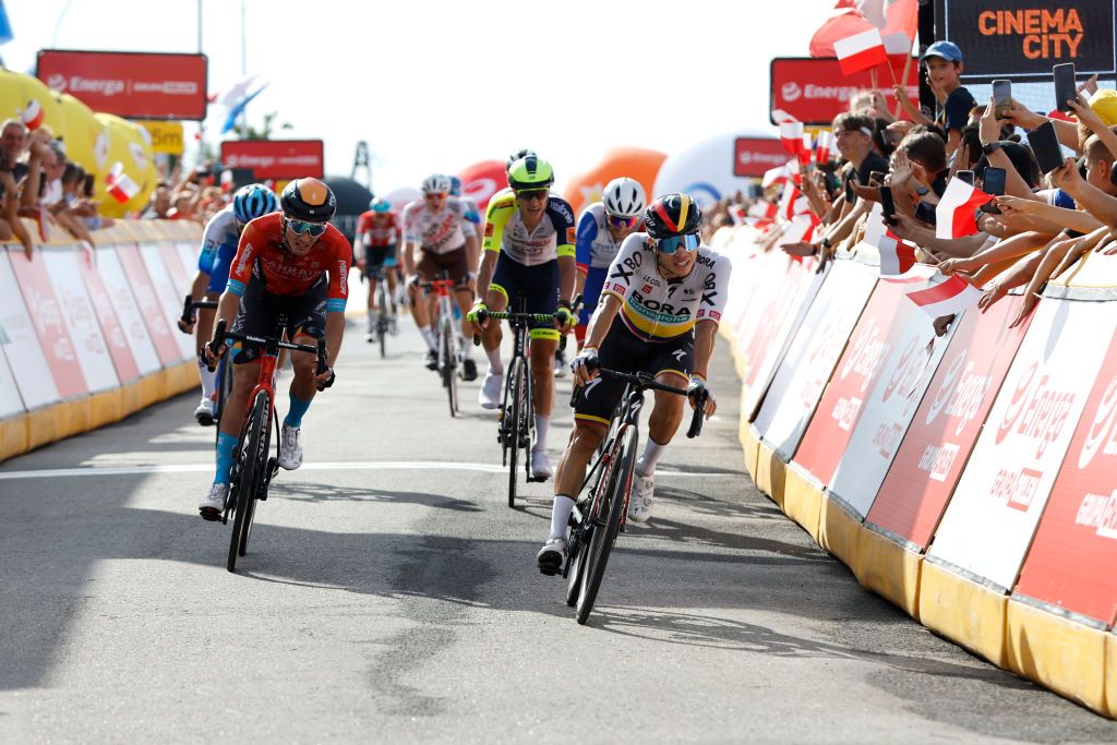 PRZEMYSL POLAND AUGUST 01 LR Pello Bilbao Lpez De Armentia of Spain and Team Bahrain Victorious and stage winner Sergio Andres Higuita Garcia of Colombia and Team Bora Hansgrohe cross the finish line during the 79th Tour de Pologne 2022 Stage 3 a 2379km stage from Kranik to Przemyl TdP22 WorldTour on August 01 2022 in Przemysl Poland Photo by Bas CzerwinskiGetty Images
