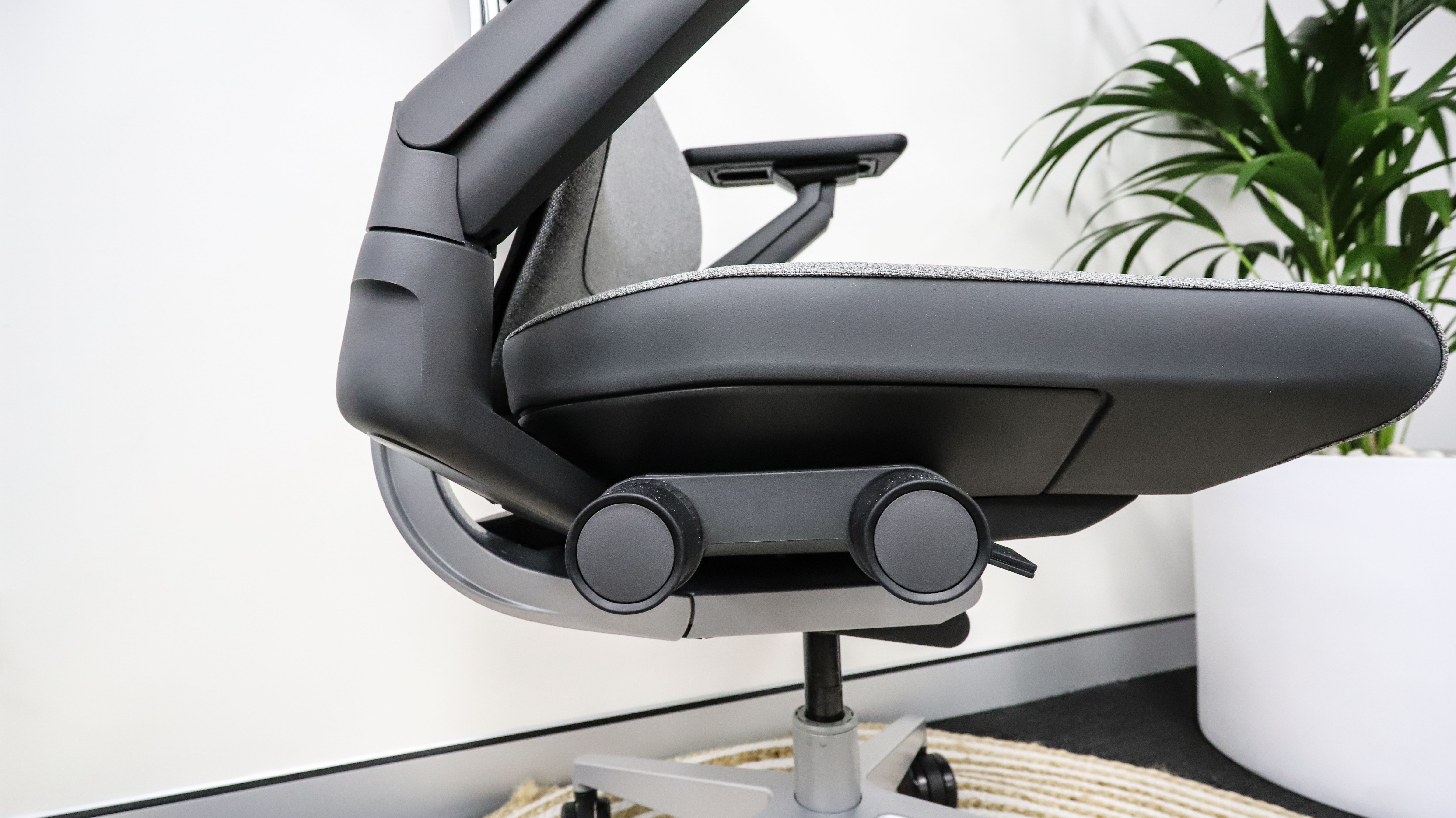 The adjustment knobs under the seat of the Steelcase Gesture