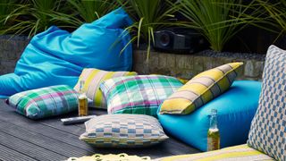 outdoor cushions and bean bags on wooden decking