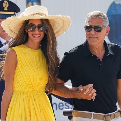 George Clooney and wife Amal are seen arriving at Marco Polo Airport in Venice for the 81st Venice International Film Festival.