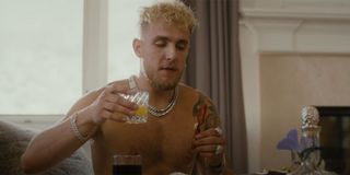 Jake Paul eating breakfast at home in music video before FBI raid