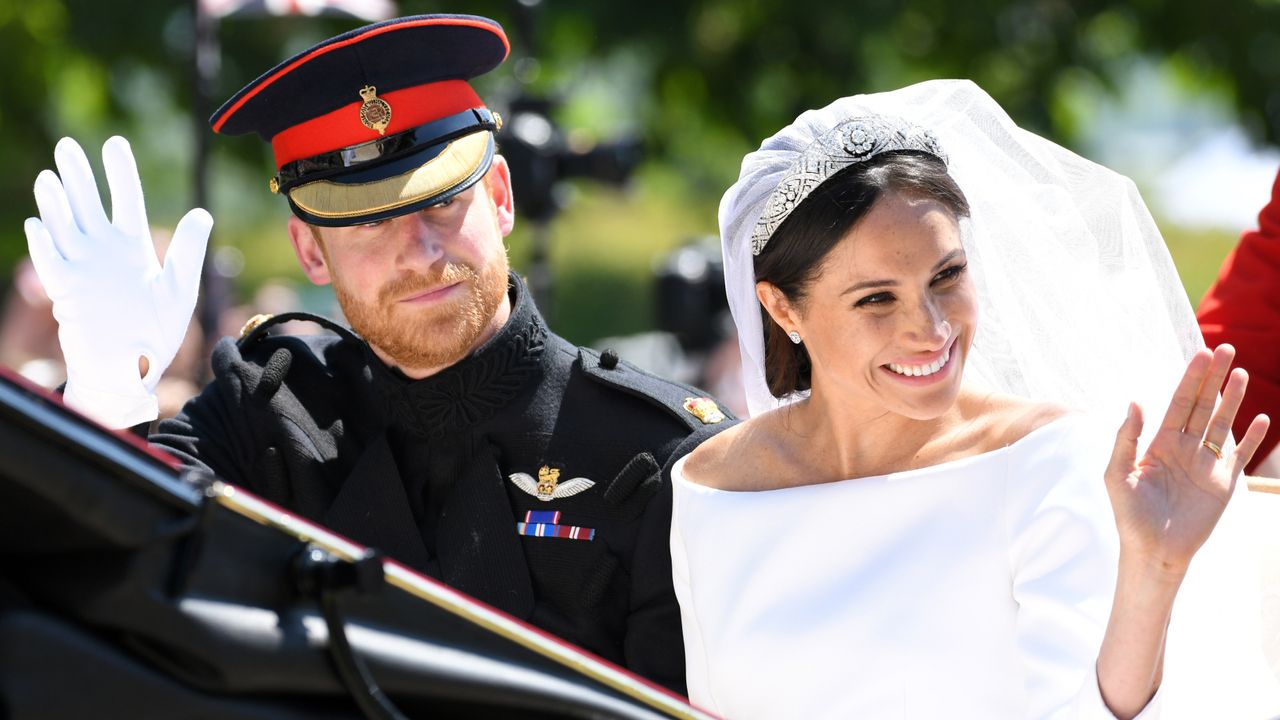 Meghan Markle independence - Prince Harry, Duke of Sussex and Meghan, Duchess of Sussex leave Windsor Castle in the Ascot Landau carriage during a procession after getting married at St Georges Chapel on May 19, 2018 in Windsor, England. Prince Henry Charles Albert David of Wales marries Ms. Meghan Markle in a service at St George&#039;s Chapel inside the grounds of Windsor Castle 