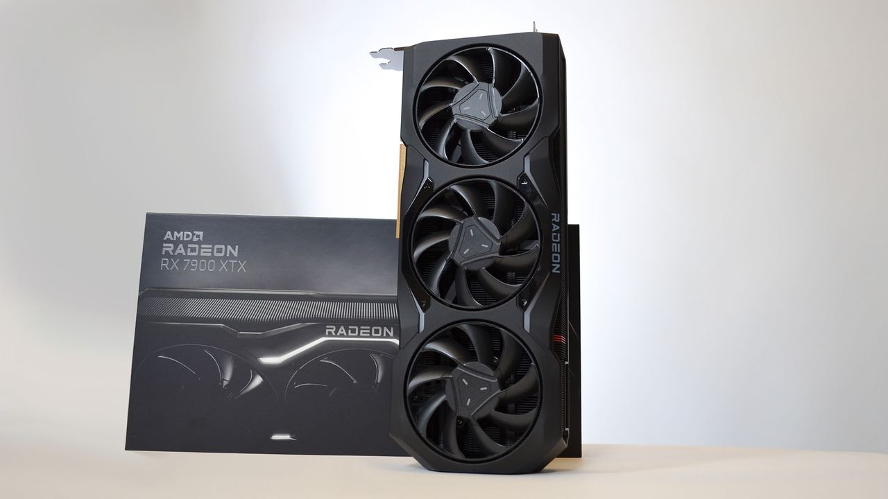 An AMD Radeon RX 7900 XTX on a table against a white backdrop