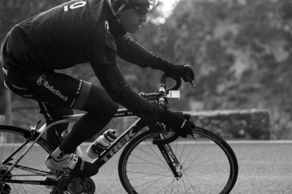 A rider makes his way down a long descent