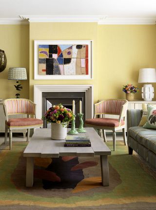 Yellow living room with statement lamps
