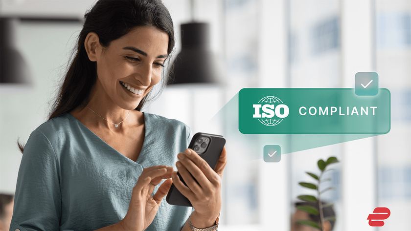 Person holding a smartphone with an ExpressVPN and ISO compliant logo and graphic 