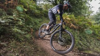 Mountain biker coming downhill on track