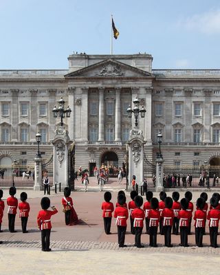 The King's Guards standing outside Buckingham Palace